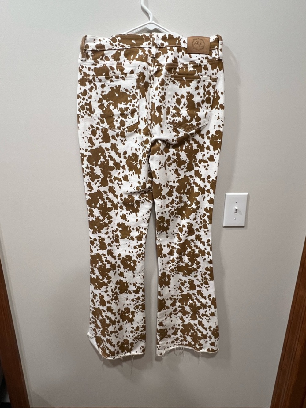 Brown and White Cow Print Flare Jeans